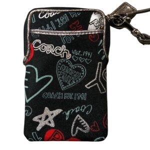 COACH  black &  silver “Poppy Collection”wristlet  zip top outside pocket